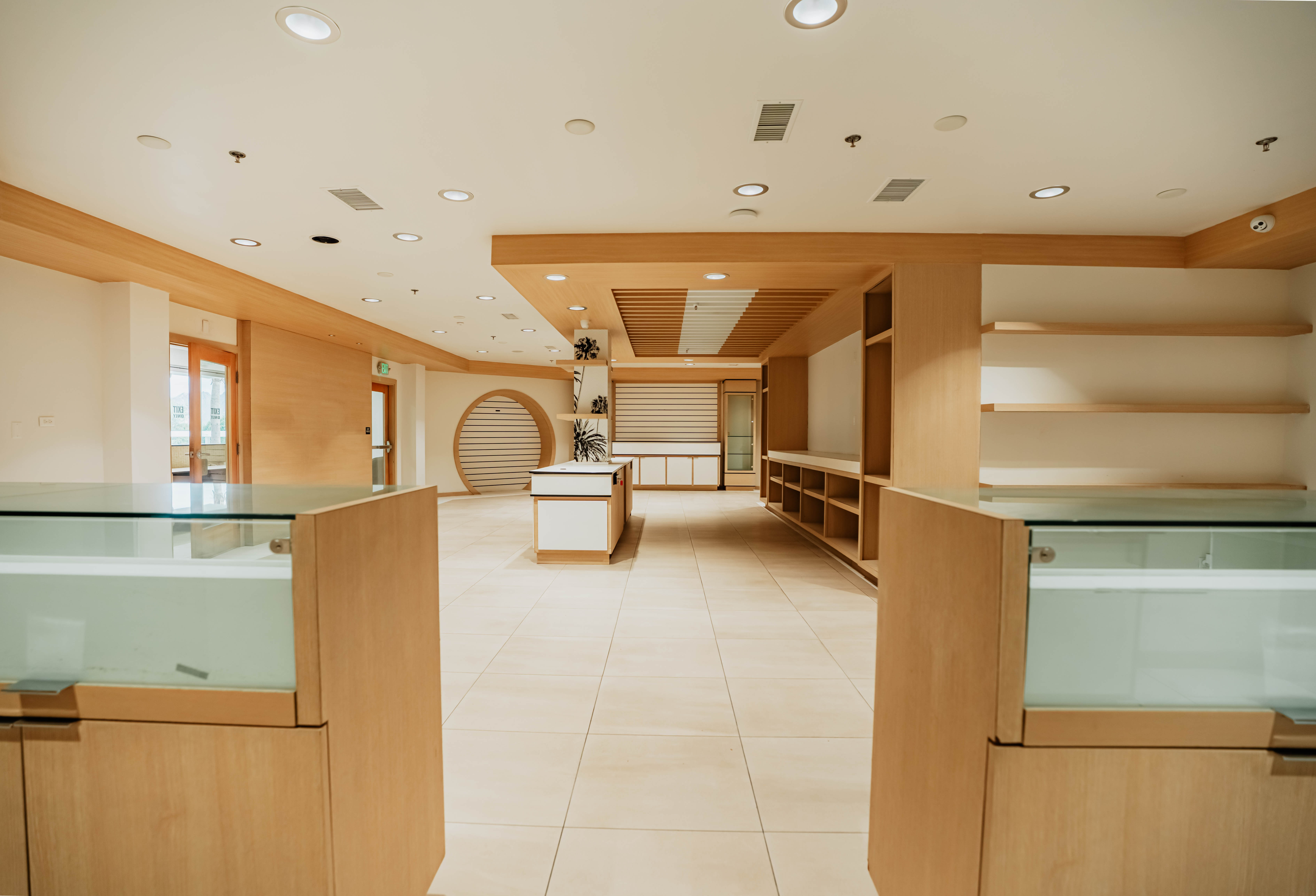 View through glass display cases toward center island